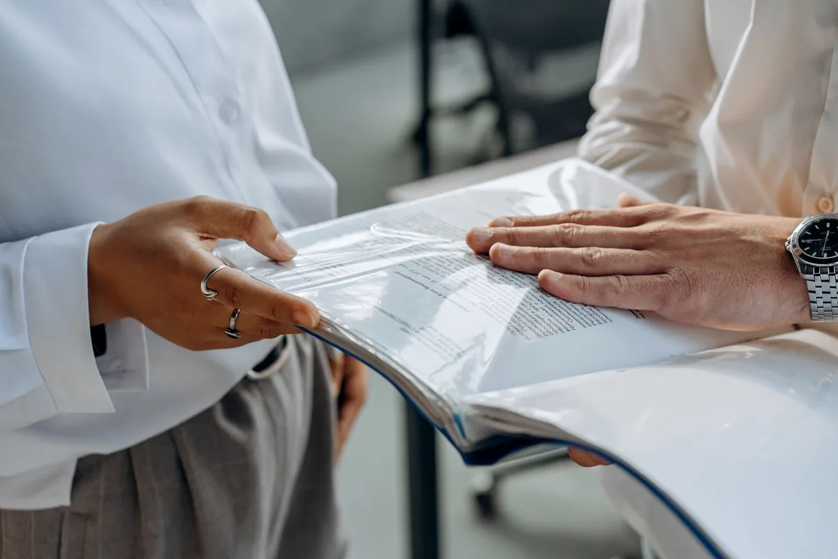 Professionals examining documents together during a consultation